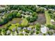 Overhead view of community featuring lake, trees, and a swimming pool area at 4310 Granby Way, Marietta, GA 30062