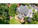 Aerial view of a home with mature trees, fire pit area, and a spacious deck at 4310 Granby Way, Marietta, GA 30062