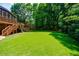 Expansive backyard featuring lush green grass and mature trees providing privacy at 4310 Granby Way, Marietta, GA 30062