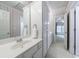 Bathroom with white cabinets, wallpaper and view to the bedroom, and a quartz countertop at 4310 Granby Way, Marietta, GA 30062
