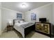 Cozy bedroom featuring a comfortable bed, dresser, and stylish decor at 4310 Granby Way, Marietta, GA 30062