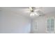 Empty bedroom featuring a ceiling fan, plantation shutters, and crown moulding at 4310 Granby Way, Marietta, GA 30062