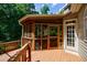 Spacious wooden deck leads to a charming screened porch, blending indoor and outdoor living at 4310 Granby Way, Marietta, GA 30062