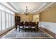 Formal dining area with a large table, chandelier, wood floors and natural light at 4310 Granby Way, Marietta, GA 30062