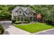 Beautifully landscaped front yard leading to an elegant home with a spacious driveway at 4310 Granby Way, Marietta, GA 30062
