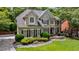Well-maintained home with lush lawn, professional landscaping, and charming exterior features at 4310 Granby Way, Marietta, GA 30062