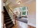 Grand foyer with hardwood floors, staircase, and large windows overlooking the backyard at 4310 Granby Way, Marietta, GA 30062