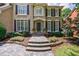 Stately home entrance with a stone walkway, manicured flower beds, and classic architectural details at 4310 Granby Way, Marietta, GA 30062