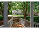 Traditional home exterior with manicured lawn and mature trees offering curb appeal and a welcoming atmosphere at 4310 Granby Way, Marietta, GA 30062