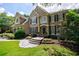 Beautiful two-story home with lush landscaping and a stone walkway to the front door at 4310 Granby Way, Marietta, GA 30062