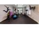 Bright home gym with multiple exercise machines and a full wall of mirrors at 4310 Granby Way, Marietta, GA 30062