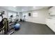 Bright home gym with multiple exercise machines and a full wall of mirrors at 4310 Granby Way, Marietta, GA 30062