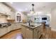 Bright kitchen features granite countertops, island sink, stainless appliances, and hardwood floors at 4310 Granby Way, Marietta, GA 30062