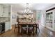 A modern kitchen area includes stainless steel appliances, custom cabinets, and a dining area at 4310 Granby Way, Marietta, GA 30062