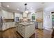 Kitchen island with granite countertops and stainless steel appliances in this modern open concept at 4310 Granby Way, Marietta, GA 30062