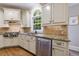 Bright kitchen features stainless appliances, granite counters, and custom cabinetry at 4310 Granby Way, Marietta, GA 30062