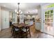 Open kitchen with dining area features stainless steel appliances, island, and access to outdoor deck at 4310 Granby Way, Marietta, GA 30062