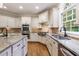 Spacious kitchen features granite countertops, stainless appliances, and custom cabinetry at 4310 Granby Way, Marietta, GA 30062