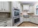 Kitchen features stainless steel appliances, custom cabinets, and granite countertops at 4310 Granby Way, Marietta, GA 30062