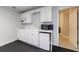 Kitchenette features white cabinets, a sink, a microwave, and a mini refrigerator at 4310 Granby Way, Marietta, GA 30062