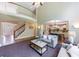 Open-concept living room with staircase, hardwood floors, and view of the kitchen at 4310 Granby Way, Marietta, GA 30062