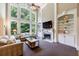 Bright living room with a fireplace, large windows, and built-in shelving at 4310 Granby Way, Marietta, GA 30062
