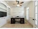 Bright office with built-in bookshelves, a ceiling fan, and natural light from the windows at 4310 Granby Way, Marietta, GA 30062