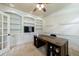 Comfortable office featuring custom built-ins, a large desk, and lots of natural light at 4310 Granby Way, Marietta, GA 30062