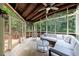 Screened-in porch featuring comfortable seating, tile floors, and a ceiling fan at 4310 Granby Way, Marietta, GA 30062