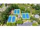 Aerial shot of community tennis courts next to a pond and parking area at 4310 Granby Way, Marietta, GA 30062