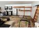 Well-organized garage with storage shelves, workbench, and ample space for parking and projects at 10980 Pinehigh Dr, Alpharetta, GA 30022