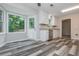 Eat-in kitchen with stainless steel appliances, backyard access and stylish gray flooring at 10980 Pinehigh Dr, Alpharetta, GA 30022