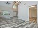 Open-concept living room with vaulted ceilings, modern flooring, and ample natural light at 10980 Pinehigh Dr, Alpharetta, GA 30022