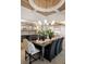 Elegant dining room with decorative ceiling and wet bar area at 113 Laurel Brook Ln, Canton, GA 30115