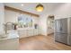 Well-lit kitchen with granite countertops and stainless steel appliances at 113 Laurel Brook Ln, Canton, GA 30115