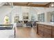 Open living room with high ceilings, fireplace, and large windows at 113 Laurel Brook Ln, Canton, GA 30115