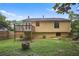 A spacious fenced backyard features a deck and a fire pit ready for your enjoyment at 1271 Muirforest Ln, Stone Mountain, GA 30088
