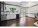 Spacious kitchen with a sink by the window and doors leading to an outdoor deck at 1271 Muirforest Ln, Stone Mountain, GA 30088
