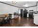 Modern kitchen featuring dark wood floors, black appliances, and white cabinets at 1271 Muirforest Ln, Stone Mountain, GA 30088