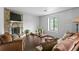 Inviting living room with stone fireplace, sleek flooring, and ample seating at 1271 Muirforest Ln, Stone Mountain, GA 30088