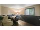 Functional office space with a desk, comfortable chairs, and a large window at 1271 Muirforest Ln, Stone Mountain, GA 30088