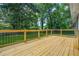 Newly constructed wooden deck overlooking the backyard and green surroundings at 1675 White Oak Way, Decatur, GA 30032