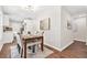 Charming dining area featuring a wooden table set for four, adjacent to the kitchen, perfect for intimate Gathering dinners at 1675 White Oak Way, Decatur, GA 30032