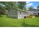 Exterior shot of a home with a wooden deck and manicured lawn at 1675 White Oak Way, Decatur, GA 30032