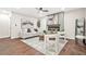 Beautifully staged living room featuring a fireplace, stylish furniture, hardwood flooring, and large windows offering ample natural light at 1675 White Oak Way, Decatur, GA 30032