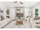 Elegant living room featuring a cozy fireplace, contemporary decor, and a neutral color palette, perfect for relaxation and entertainment at 1675 White Oak Way, Decatur, GA 30032
