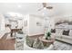 Open concept living and dining area featuring modern decor, hardwood floors, and abundant natural light, perfect for Gathering gatherings at 1675 White Oak Way, Decatur, GA 30032