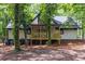 Home featuring backyard deck and lush landscaping at 6486 Aquila Dr, Morrow, GA 30260