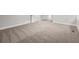 Expansive basement area with neutral carpeting and ample space at 6486 Aquila Dr, Morrow, GA 30260