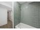 Close up on stylish shower and tile surround at 6486 Aquila Dr, Morrow, GA 30260
